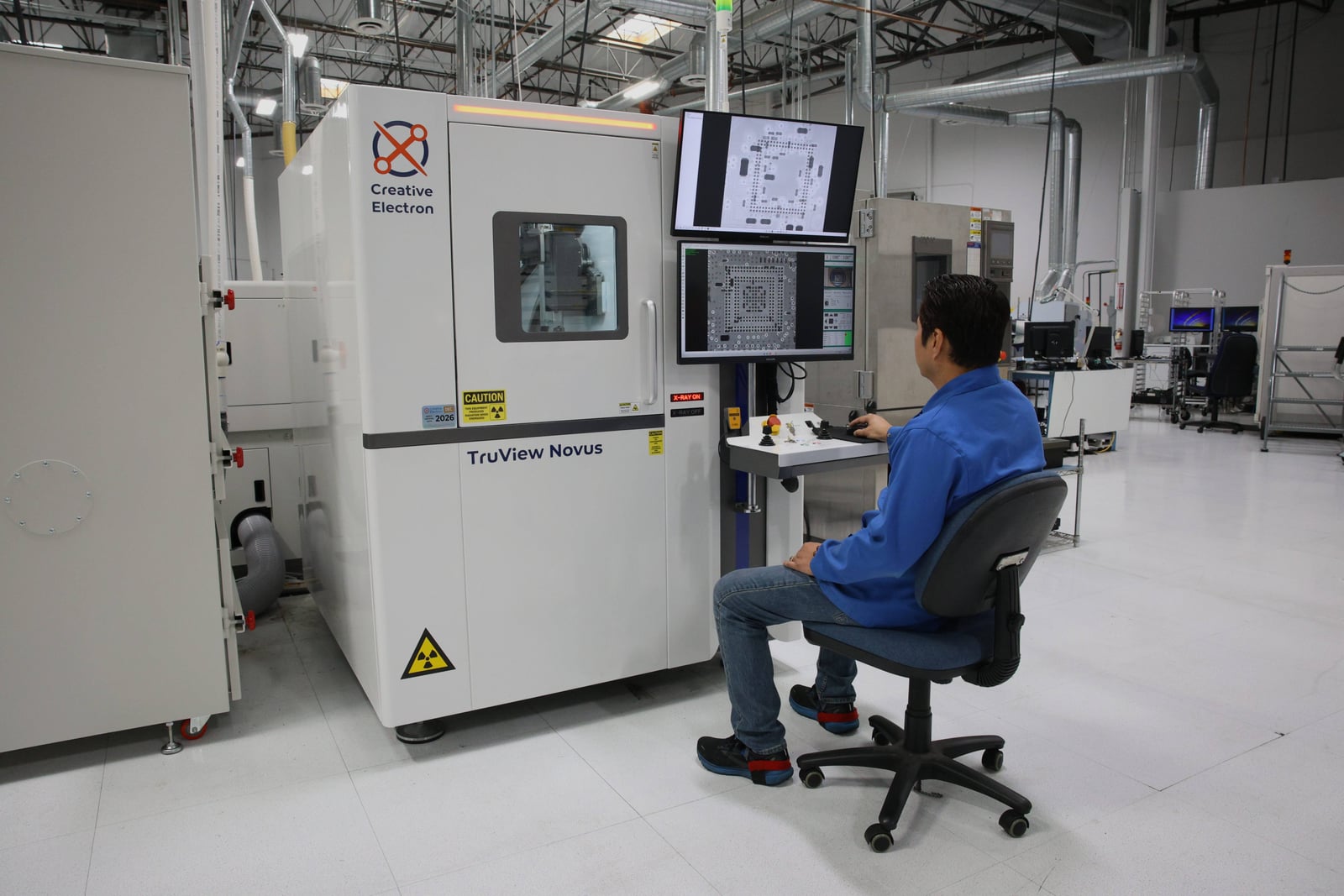 Technician reviewing X-ray images at the Creative Electron TruView Novus